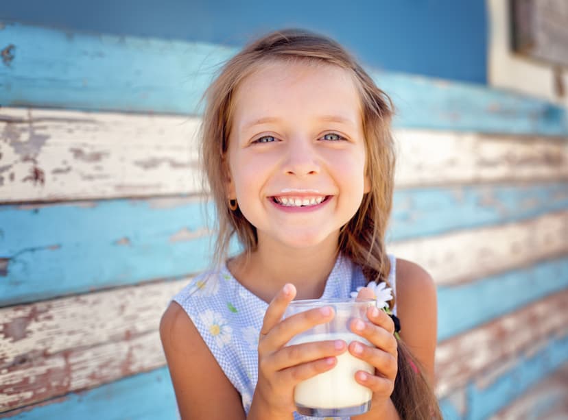 Family pouring a glass of fresh whole milk — donate to support 97 Milk education